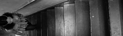 Mary Gold at the bottom of a flight of stairs